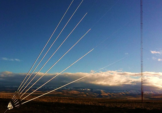 Tall steel lattice broadcast structure supported by high-tensile guy cables